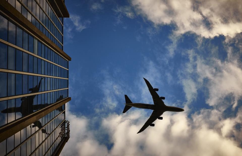 An airplane in the sky, illustrating how to find flight deals