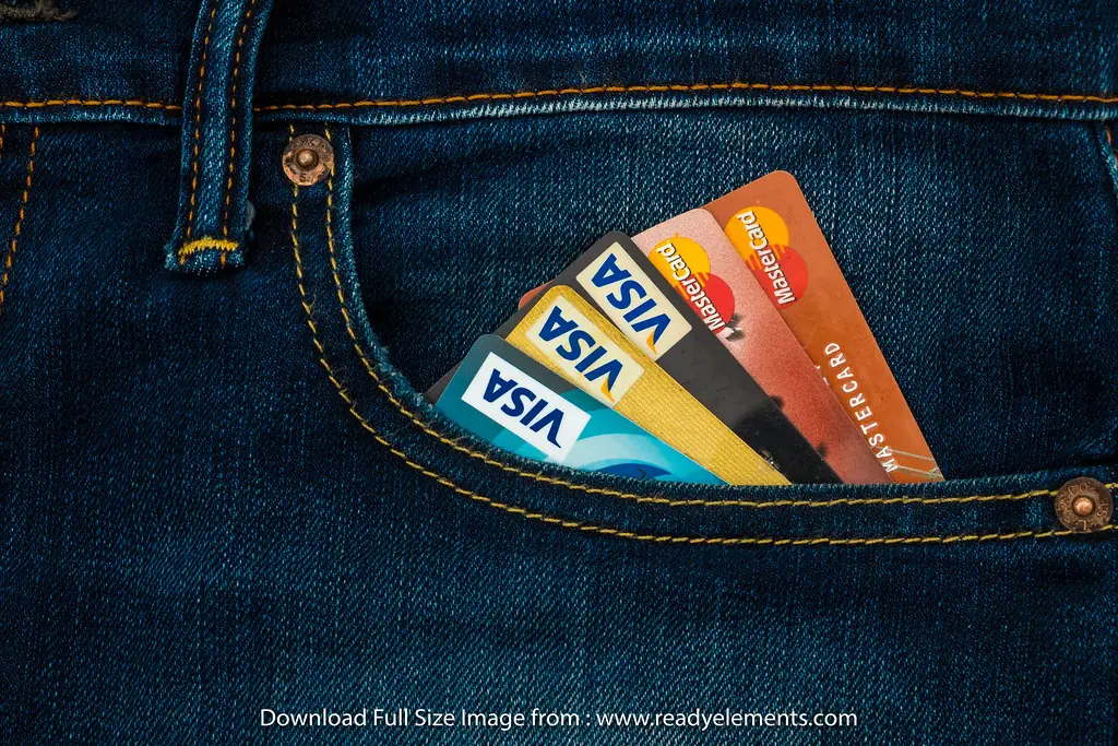 Credit cards tucked into the back pocket of jeans