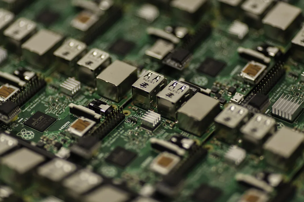 Close-up of a circuit board with chips and USB ports, representing computer memory and storage