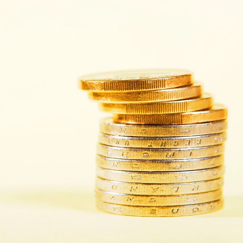 A neat stack of coins, representing saving and investing