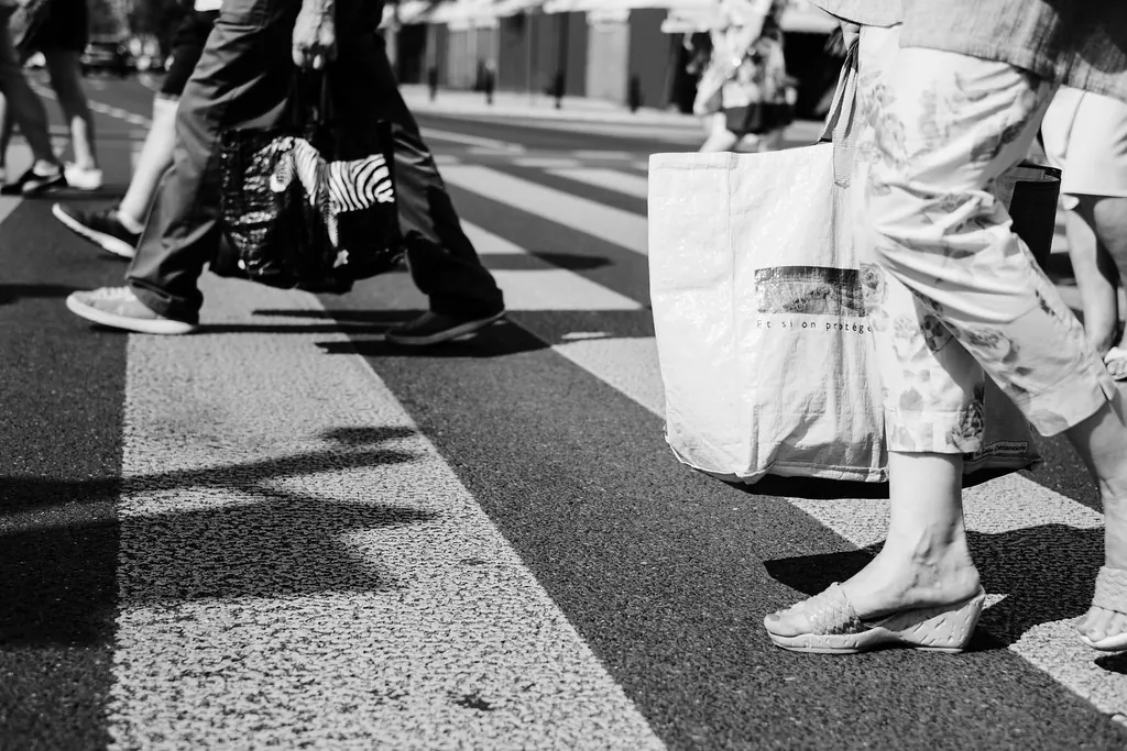 People walking across a pedestrian crossing